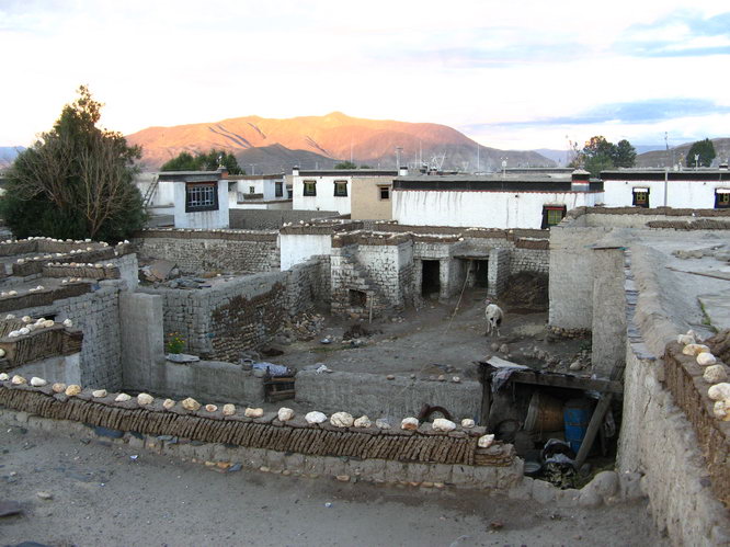 View from penthouse bathroom. Please take notice of the neatly piled Yak/Cow dung. Lifetime supply to anyone who can count them all.